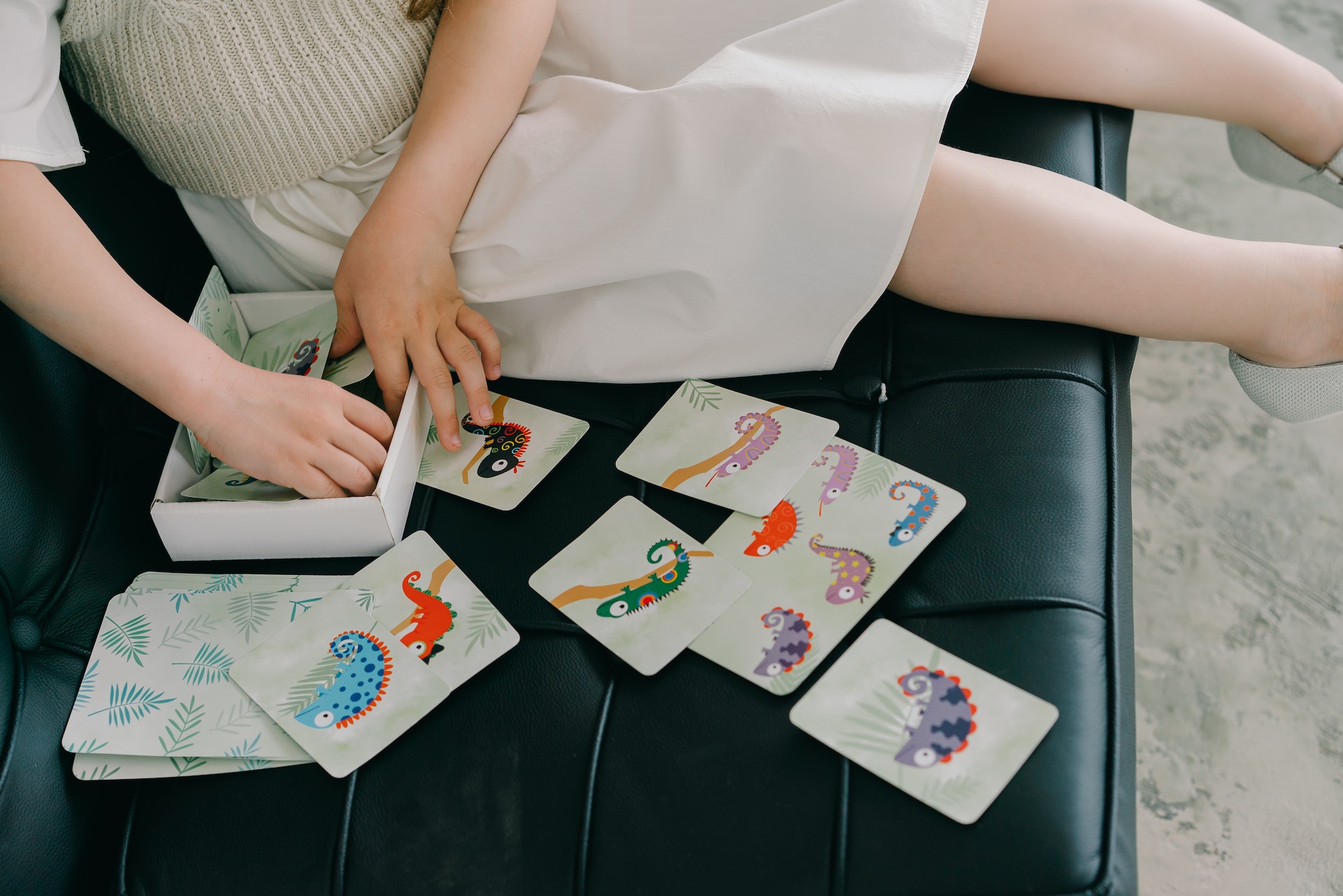 a kid checking animal play cards